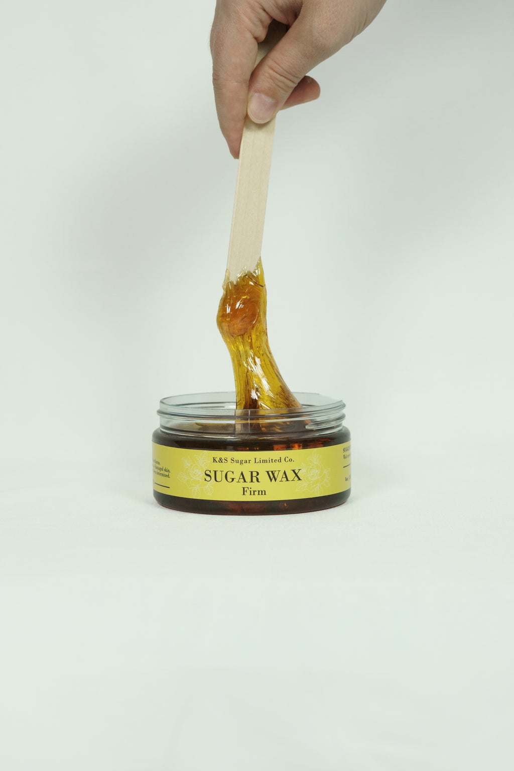 Firm sugar wax