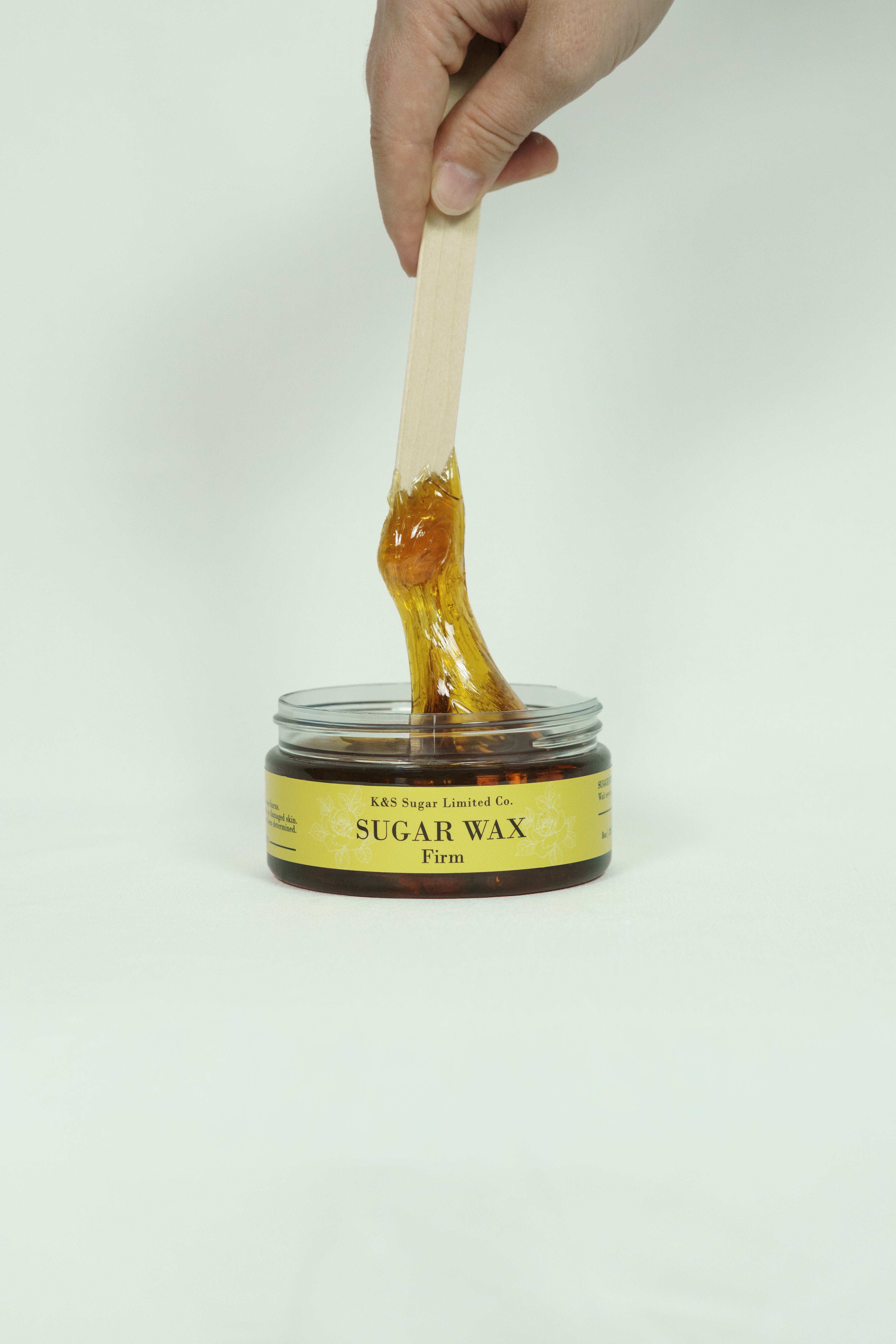 Firm sugar wax