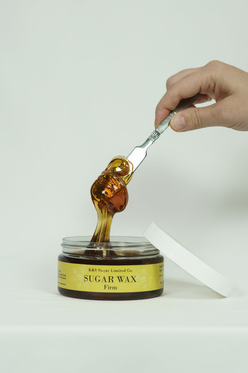 Firm sugar wax